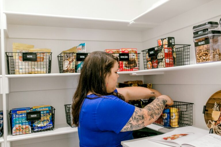 Labeled storage baskets arranged on a pantry shelf